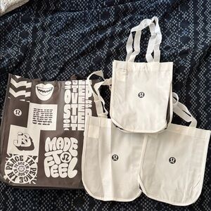 (4) Lululemon Reusable Tote Bags - White and Brown Graphics - 1 large 3 small